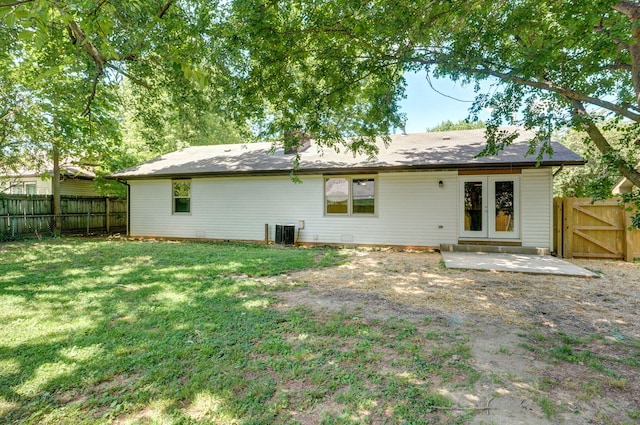 3656 S Kansas Ave, Springfield, MO 65807 - back of house with a fenced backyard, a patio, and a gate