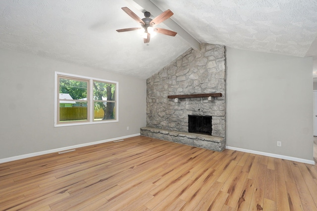 3656 S Kansas Ave, Springfield, MO 65807 - unfurnished living room featuring a ceiling fan, wood finished floors, a fireplace, and a textured ceiling
