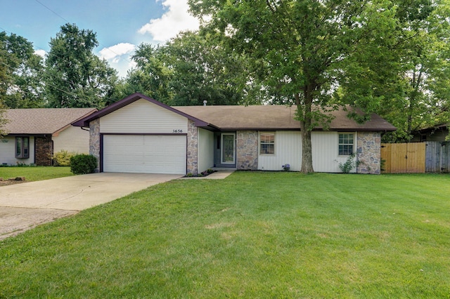 3656 S Kansas Ave, Springfield, MO 65807 - ranch-style house with stone siding, a garage, and driveway