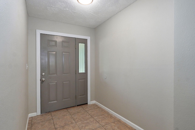 3656 S Kansas Ave, Springfield, MO 65807 - foyer featuring light tile patterned floors and baseboards
