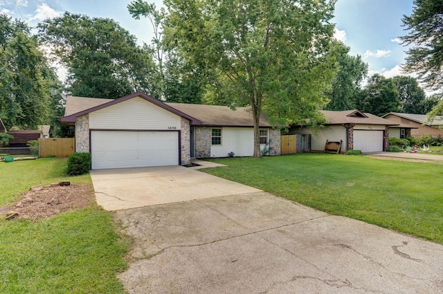 3656 S Kansas Ave, Springfield, MO 65807 - view of front of house with a garage, concrete driveway, and stone siding