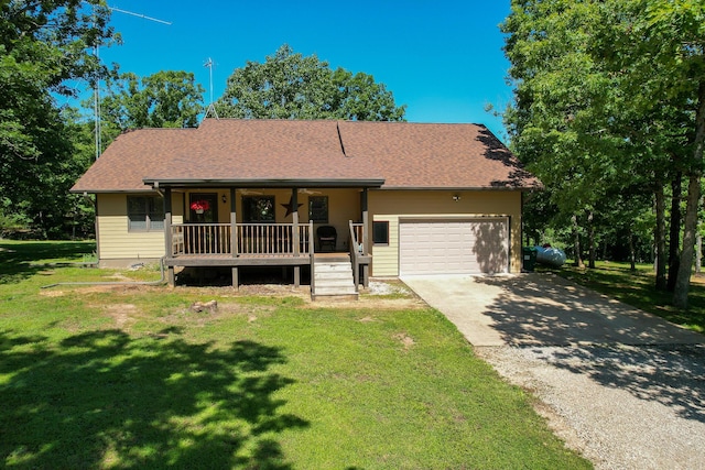 10675 State Highway Aa, Grovespring, MO 65662 - view of front of home featuring covered porch, an attached garage, a front lawn, asphalt driveway, and roof with shingles