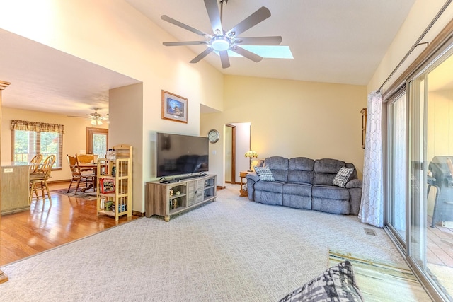 10675 State Highway Aa, Grovespring, MO 65662 - living room with a ceiling fan, a skylight, wood finished floors, and high vaulted ceiling