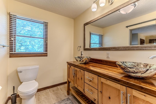 10675 State Highway Aa, Grovespring, MO 65662 - bathroom featuring double vanity and a textured ceiling
