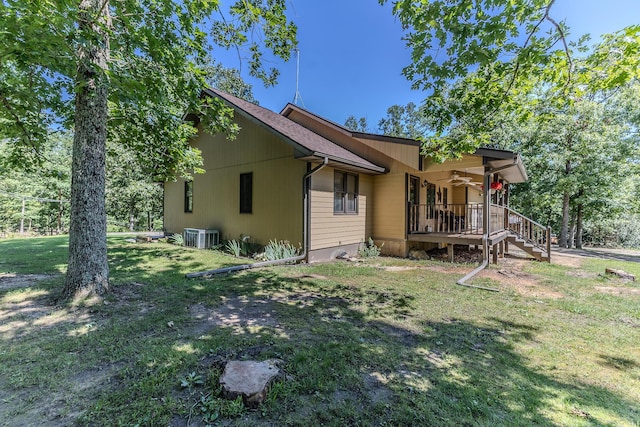 10675 State Highway Aa, Grovespring, MO 65662 - view of side of home featuring a ceiling fan, a lawn, and a porch