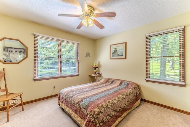 10675 State Highway Aa, Grovespring, MO 65662 - carpeted bedroom featuring a textured ceiling and a ceiling fan
