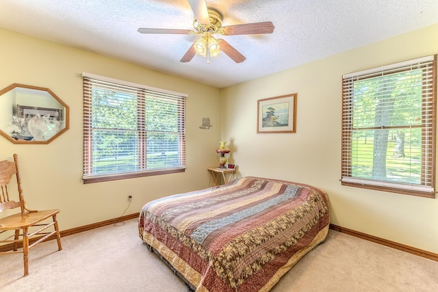 10675 State Highway Aa, Grovespring, MO 65662 - carpeted bedroom with a textured ceiling and a ceiling fan