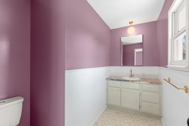 3218 W Aaron Dr, Springfield, MO 65810 - bathroom featuring a wainscoted wall, vanity, and tile patterned floors