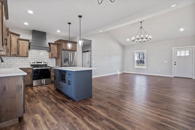 2803 Town Dr, Mountain Grove, MO 65711 - kitchen featuring stainless steel appliances, premium range hood, vaulted ceiling, decorative backsplash, and a center island