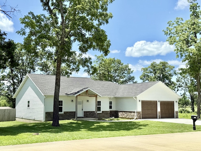 2803 Town Dr, Mountain Grove, MO 65711 - view of front of home with stone siding, a garage, driveway, and roof with shingles