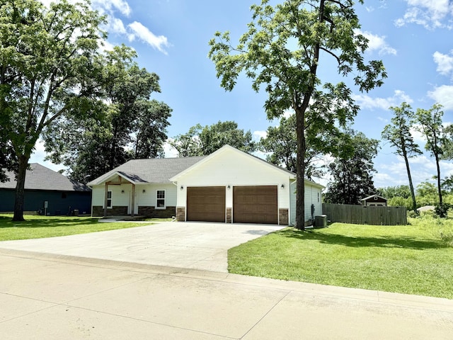 2803 Town Dr, Mountain Grove, MO 65711 - view of front of house featuring an attached garage, driveway, and stone siding