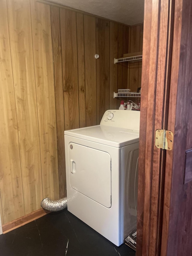428 N Olive St, Marshfield, MO 65706 - washroom with washer / dryer and wooden walls