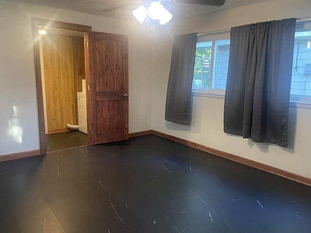 428 N Olive St, Marshfield, MO 65706 - empty room with ceiling fan and washer / clothes dryer