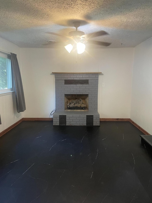 428 N Olive St, Marshfield, MO 65706 - unfurnished living room with ceiling fan, a textured ceiling, and a brick fireplace