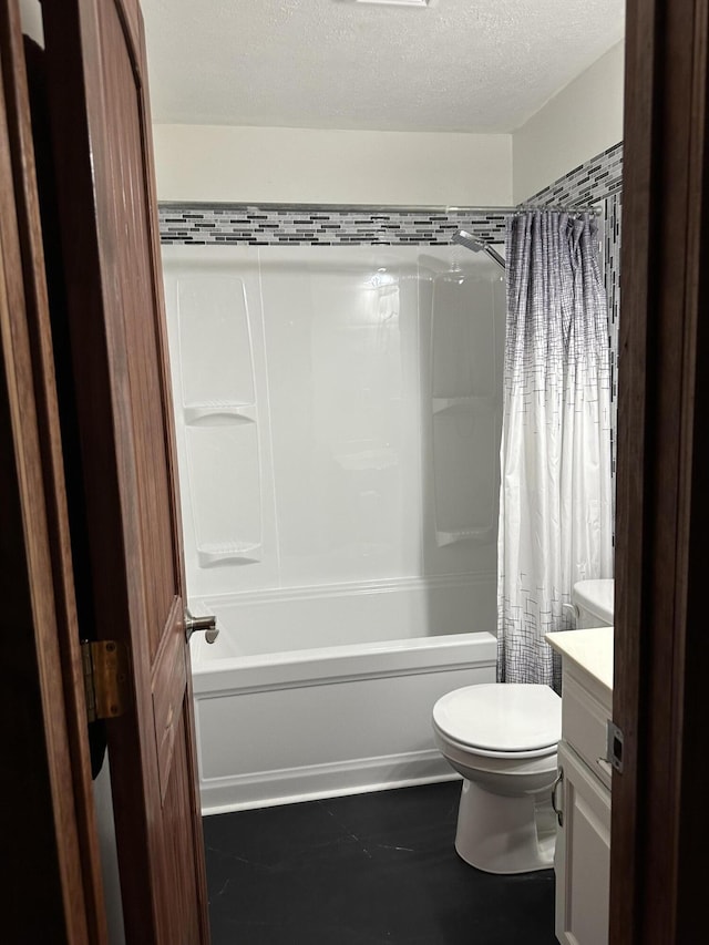 428 N Olive St, Marshfield, MO 65706 - bathroom featuring vanity, shower / bath combo, and a textured ceiling