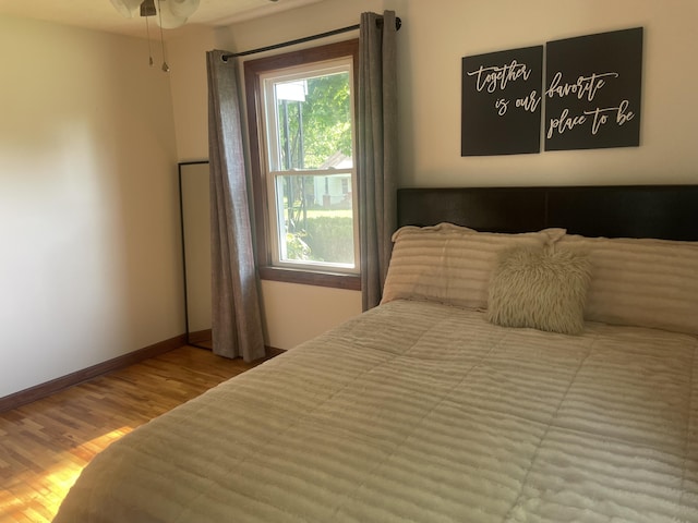 428 N Olive St, Marshfield, MO 65706 - bedroom with wood finished floors and baseboards
