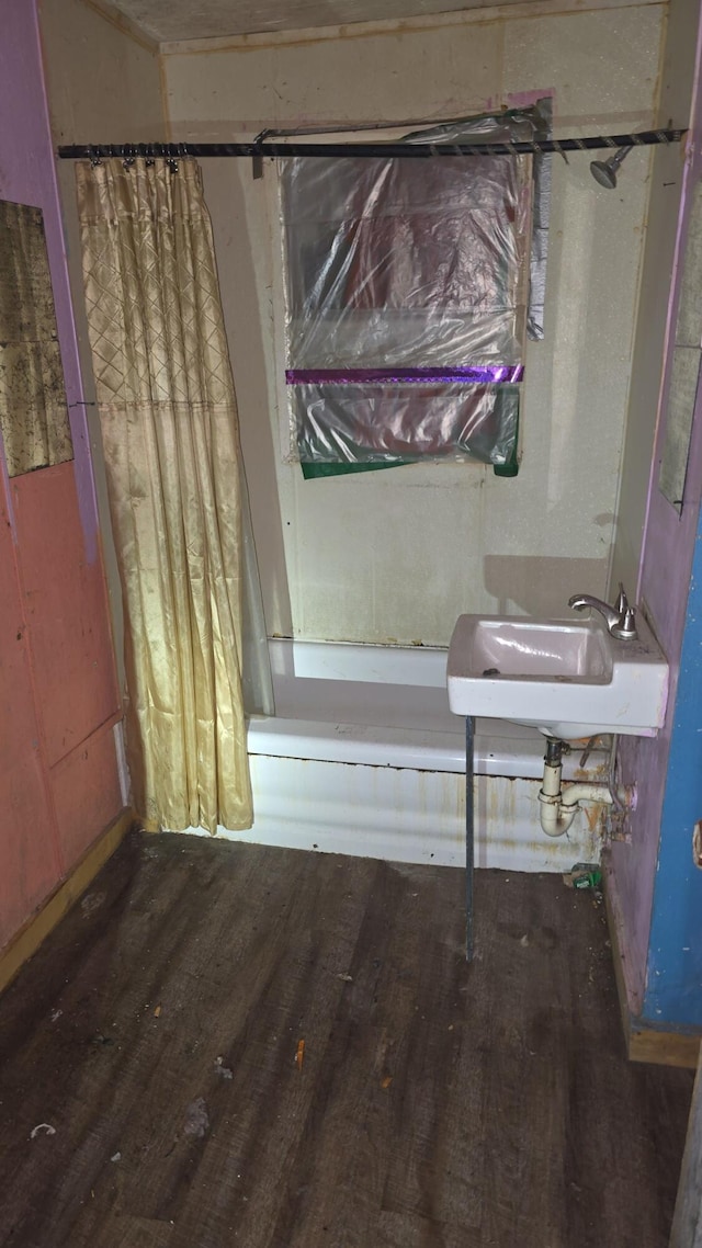 1301 N Rogers Ave, Springfield, MO 65802 - bathroom featuring wood finished floors and shower / bath combination with curtain