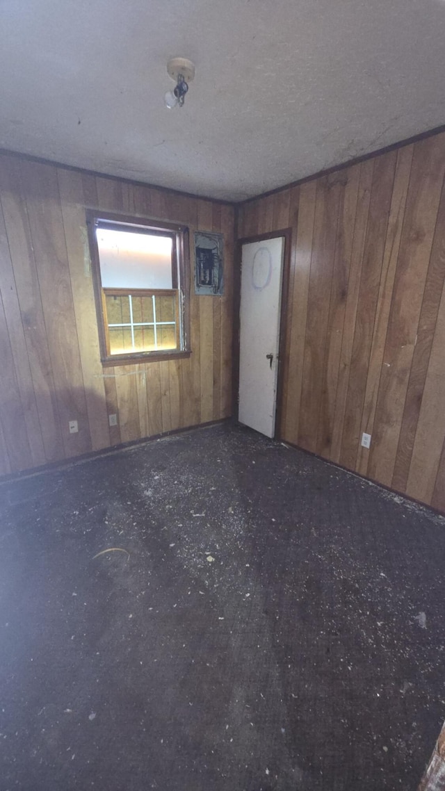 1301 N Rogers Ave, Springfield, MO 65802 - spare room with wooden walls