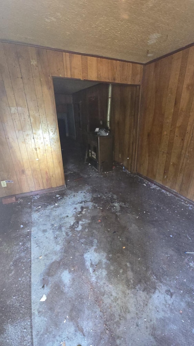 1301 N Rogers Ave, Springfield, MO 65802 - spare room featuring wood walls and concrete floors