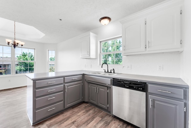 639 N Althea Ave, Nixa, MO 65714 - kitchen with dishwasher, gray cabinets, a peninsula, white cabinets, and a textured ceiling