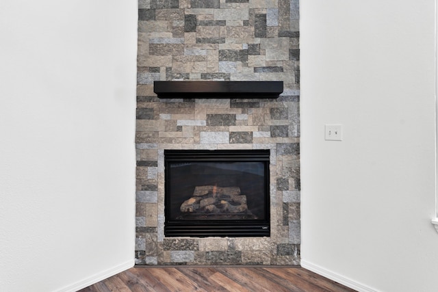 639 N Althea Ave, Nixa, MO 65714 - detailed view of a stone fireplace and wood finished floors