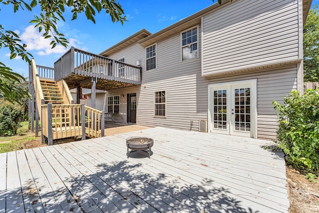 639 N Althea Ave, Nixa, MO 65714 - wooden deck with a fire pit, stairway, and french doors