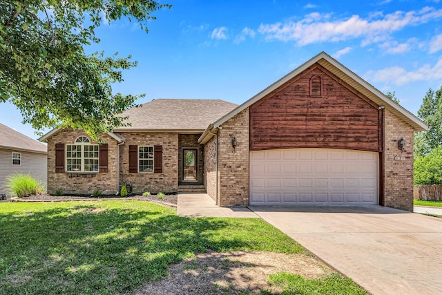 639 N Althea Ave, Nixa, MO 65714 - view of front of home featuring driveway, a front lawn, an attached garage, brick siding, and roof with shingles