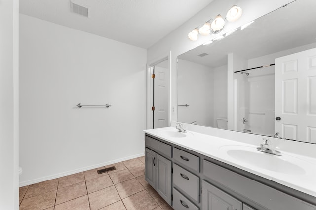639 N Althea Ave, Nixa, MO 65714 - bathroom featuring double vanity, tile patterned floors, and a shower