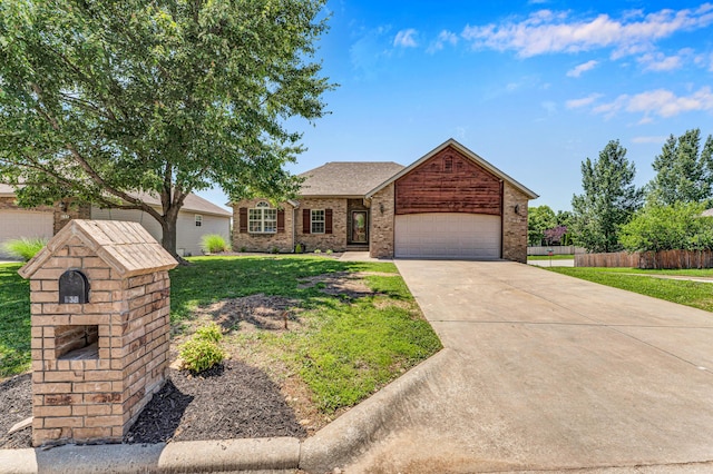 639 N Althea Ave, Nixa, MO 65714 - ranch-style house featuring concrete driveway, a garage, and brick siding