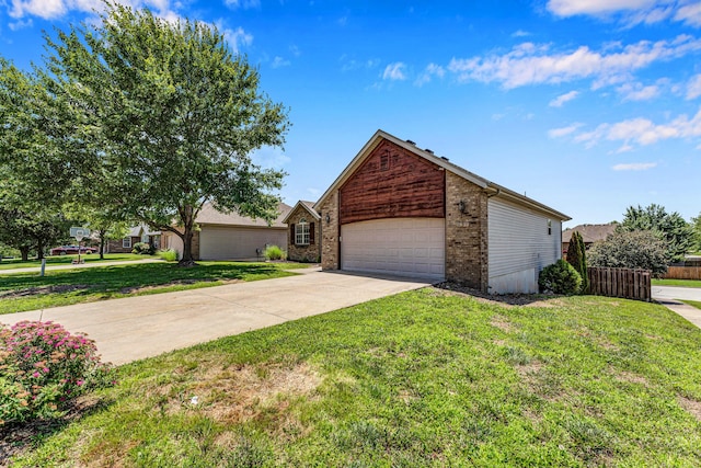 639 N Althea Ave, Nixa, MO 65714 - view of front of home with driveway, an attached garage, and brick siding