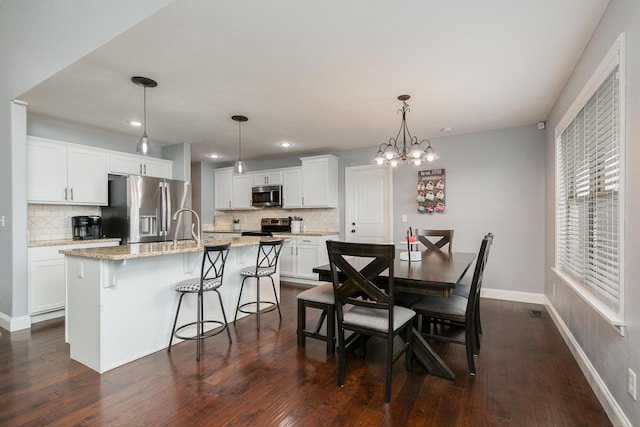 1925 E Costa Mesa Ct, Ozark, MO 65721 - dining area featuring dark wood-type flooring, recessed lighting, and a chandelier