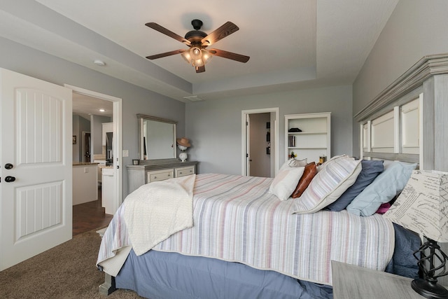 1925 E Costa Mesa Ct, Ozark, MO 65721 - bedroom with a tray ceiling, carpet flooring, ensuite bath, and ceiling fan