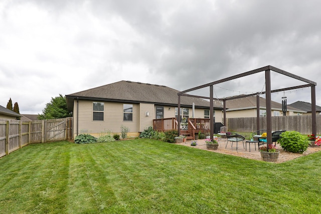 1925 E Costa Mesa Ct, Ozark, MO 65721 - back of property featuring a patio area, a fenced backyard, a wooden deck, and roof with shingles