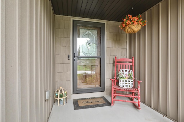 1925 E Costa Mesa Ct, Ozark, MO 65721 - doorway to property with covered porch and board and batten siding