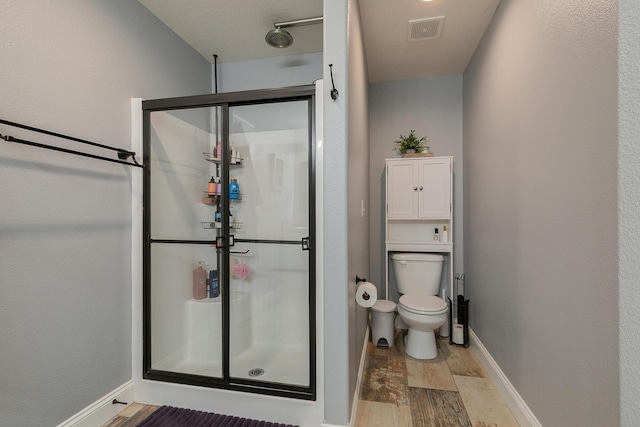 1925 E Costa Mesa Ct, Ozark, MO 65721 - bathroom featuring wood finished floors and a shower stall