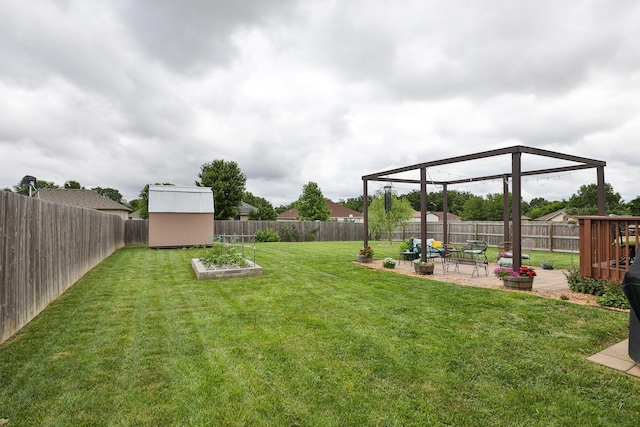 1925 E Costa Mesa Ct, Ozark, MO 65721 - fenced backyard featuring a storage unit, a patio, and a vegetable garden