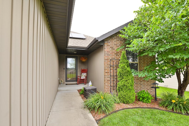 1925 E Costa Mesa Ct, Ozark, MO 65721 - property entrance featuring brick siding and roof with shingles