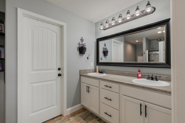 1925 E Costa Mesa Ct, Ozark, MO 65721 - full bath with double vanity, wood finished floors, and a shower