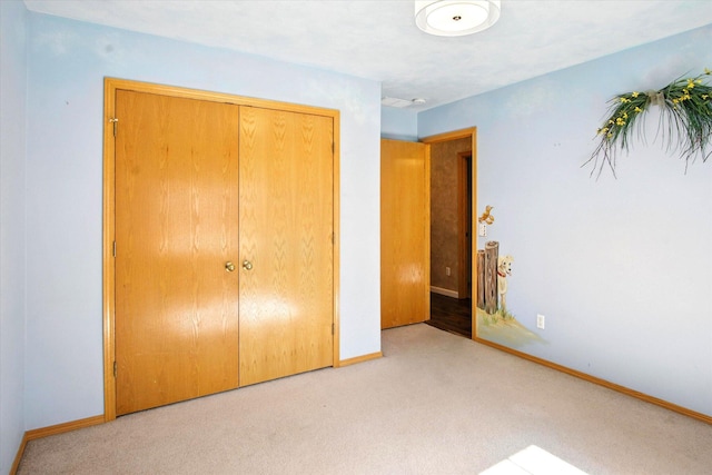 4939 S Prairie View Ave, Battlefield, MO 65619 - unfurnished bedroom featuring carpet flooring and a closet