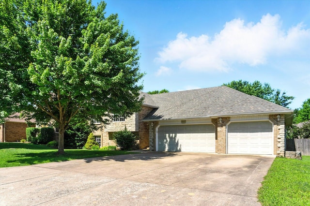 4939 S Prairie View Ave, Battlefield, MO 65619 - view of front of property with concrete driveway, brick siding, an attached garage, a front lawn, and a shingled roof