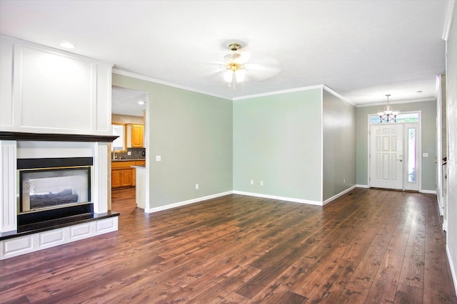 4939 S Prairie View Ave, Battlefield, MO 65619 - unfurnished living room featuring dark wood-style floors, ornamental molding, a chandelier, and recessed lighting