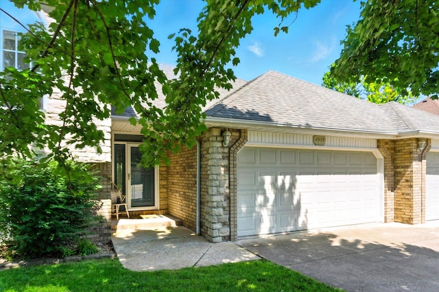 4939 S Prairie View Ave, Battlefield, MO 65619 - view of front facade featuring a garage, brick siding, and roof with shingles