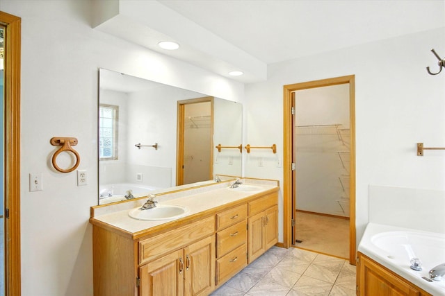 4939 S Prairie View Ave, Battlefield, MO 65619 - full bath with a garden tub, a spacious closet, double vanity, and recessed lighting