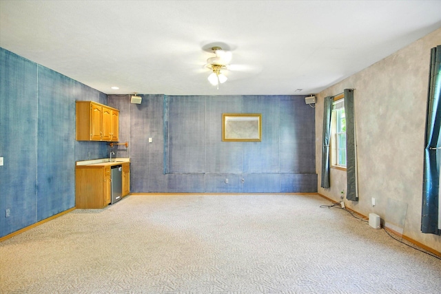 4939 S Prairie View Ave, Battlefield, MO 65619 - unfurnished living room featuring ceiling fan and baseboards