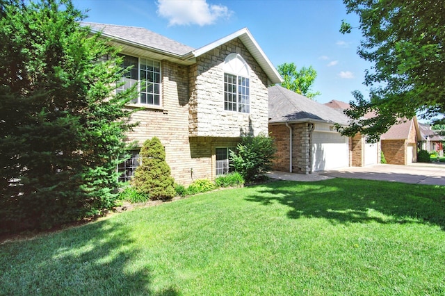 4939 S Prairie View Ave, Battlefield, MO 65619 - split level home featuring an attached garage, concrete driveway, stone siding, a front yard, and roof with shingles