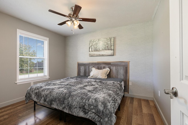 1020 Berkley Dr, Marshfield, MO 65706 - bedroom with wood finished floors, an accent wall, and ceiling fan