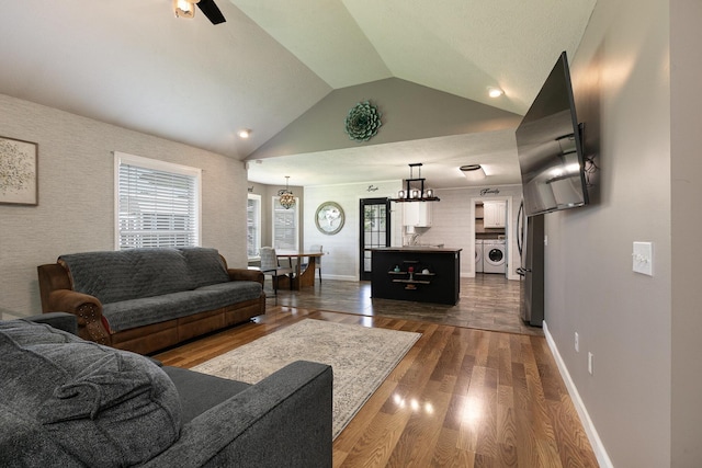 1020 Berkley Dr, Marshfield, MO 65706 - living area featuring lofted ceiling, dark wood-style flooring, and ceiling fan