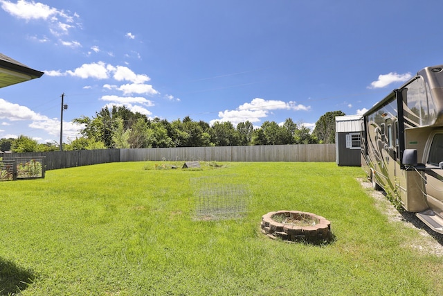 1020 Berkley Dr, Marshfield, MO 65706 - fenced backyard with a storage shed and an outdoor fire pit
