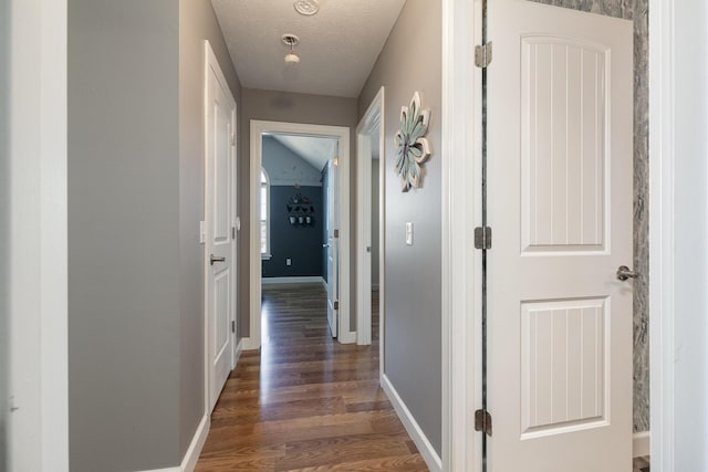 1020 Berkley Dr, Marshfield, MO 65706 - corridor featuring wood finished floors and a textured ceiling