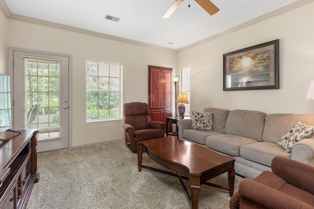 300 Glory Rd Unit 2, Branson, MO 65616 - living area featuring crown molding, healthy amount of natural light, a ceiling fan, and light colored carpet